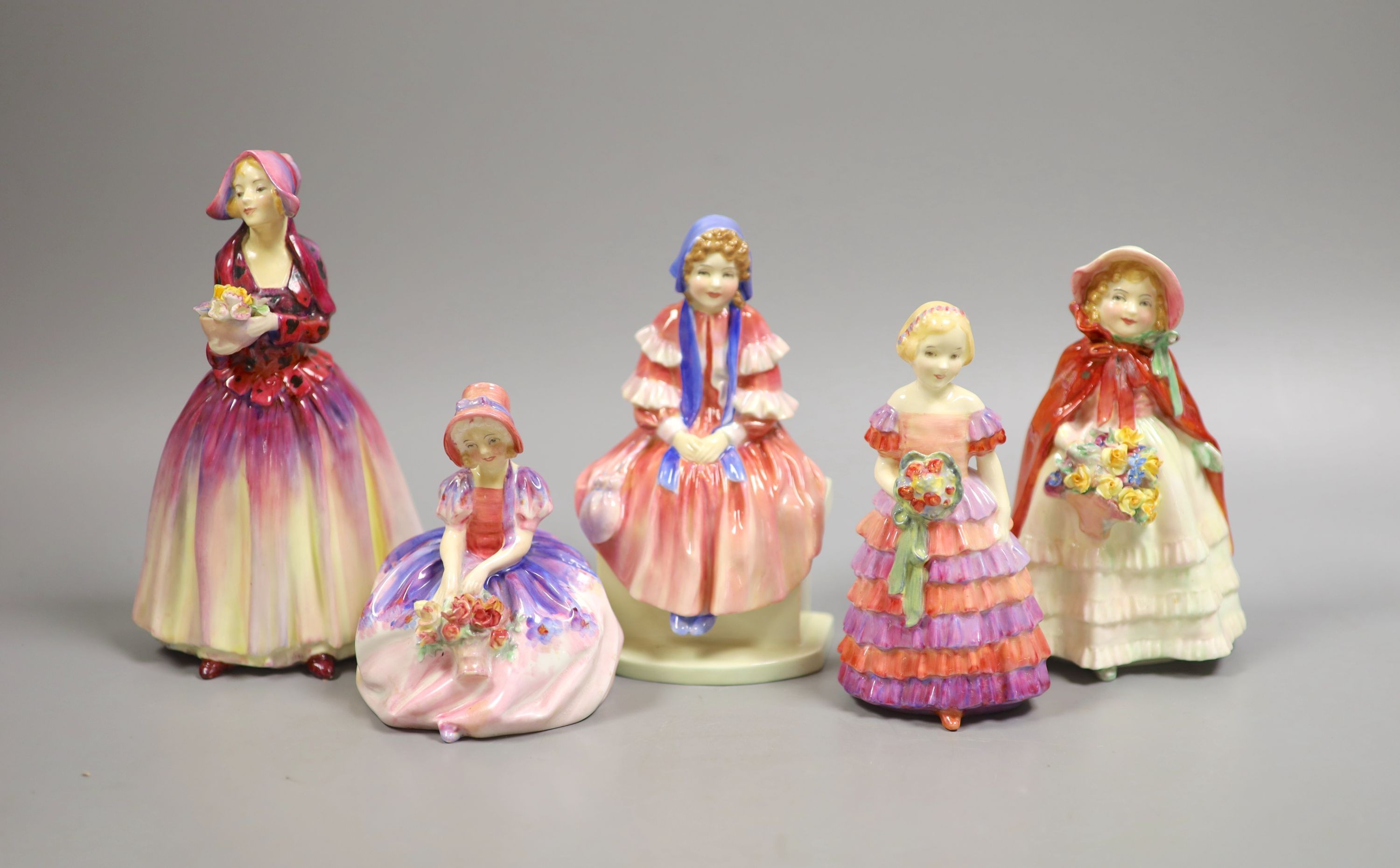 Five Royal Doulton figurines: Dorcas RN769308, Forget-me-not RN816194, Granny's shawl HN1647 RN704188, Monica HN1467 RN762875, Little Bridesmaid HN1453 Rn760007